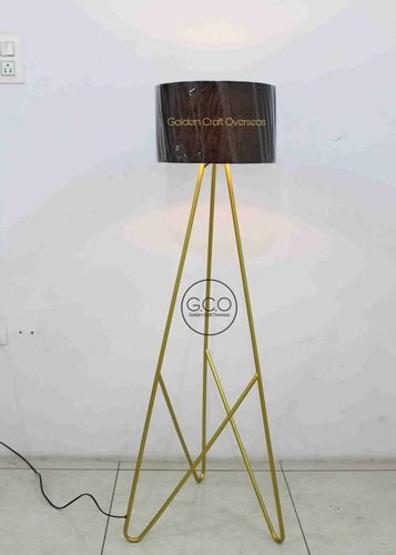 Tripod design floor lamp in iron with black fabric shade