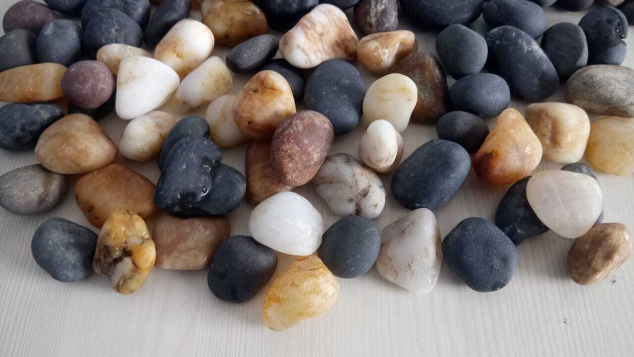 Mix colored natural river pebbles for exterior and garden decoration