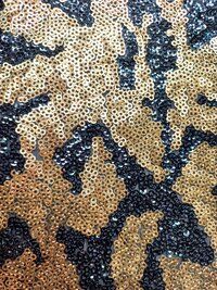 Gold and black sequin fabric for ladies in india