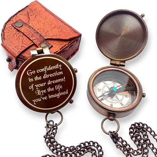 A  Brown Antique Finish Thoreau'S Go Confidently Quote Engraved Compass With Stamped Leather Case