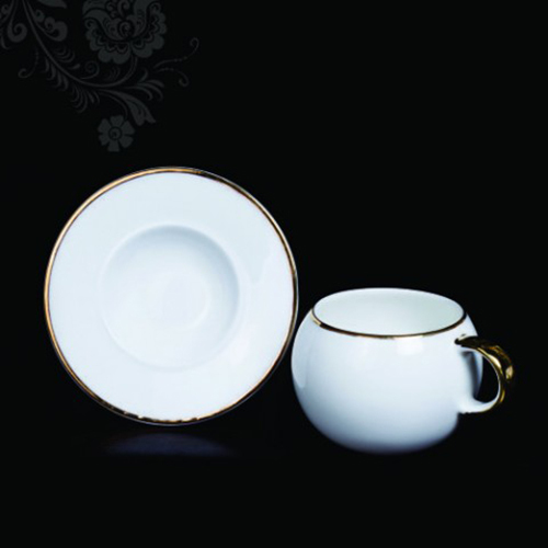 CERAMIC CUP AND WHITE SAUCER