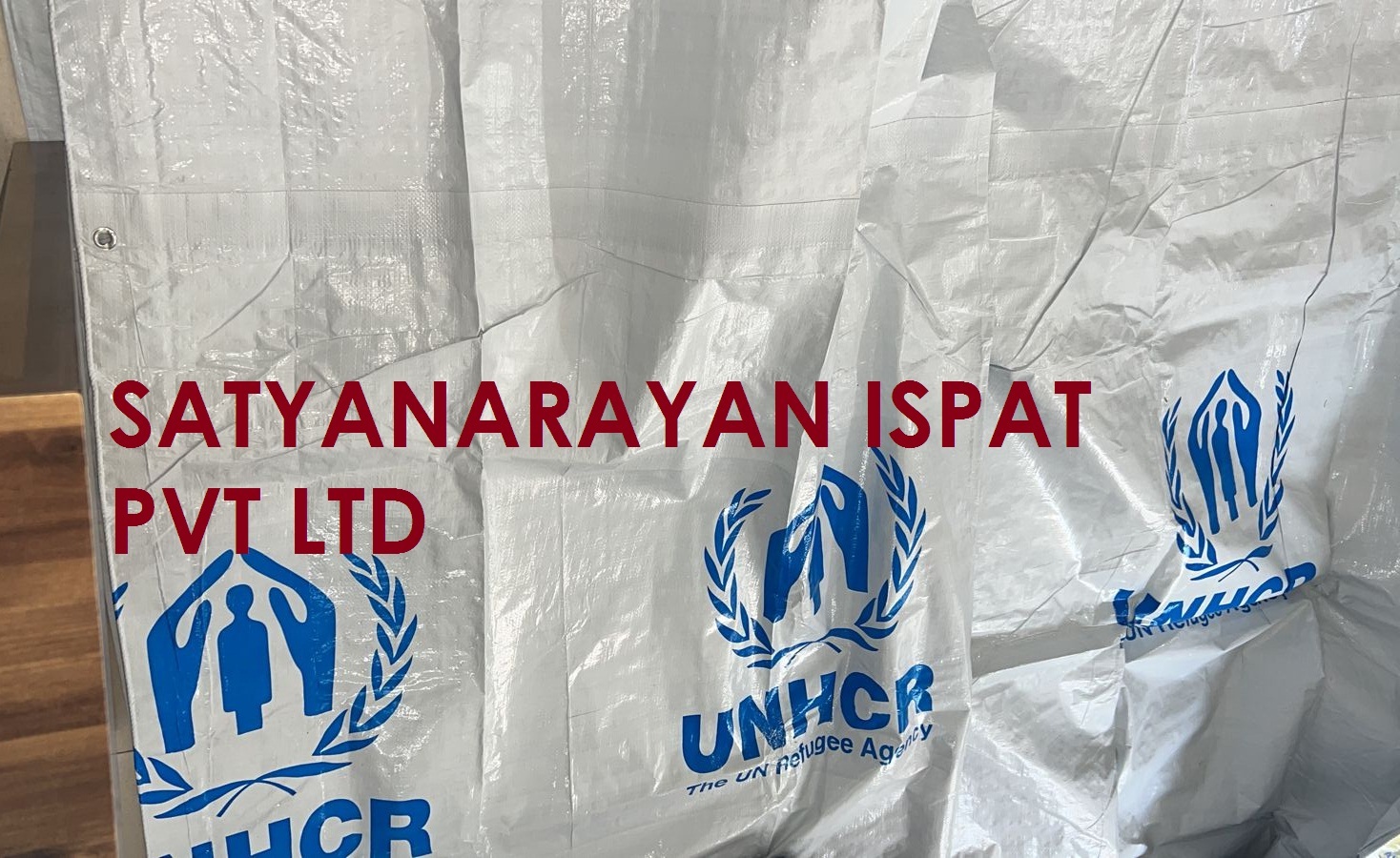 RELIEF TARPAULIN COVER WITH REINFORCEMENT BANDS
