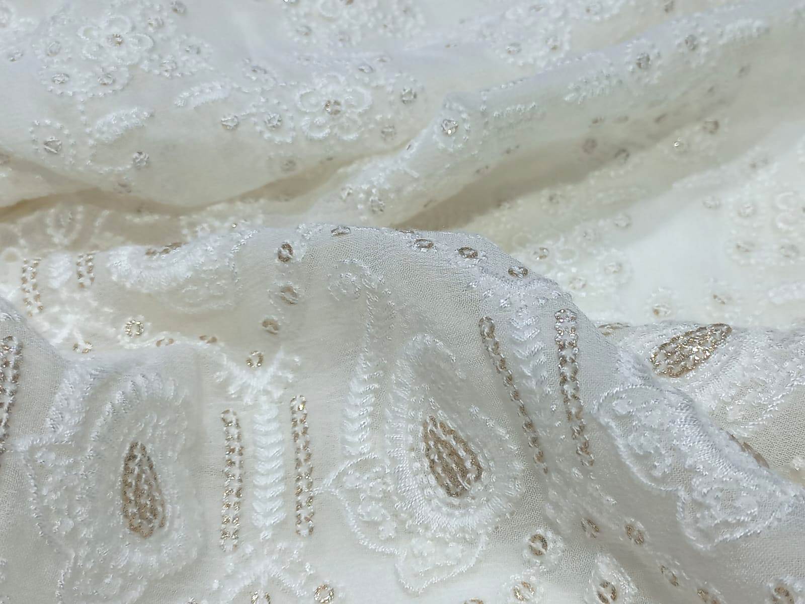 White schiffli embroidery fabric on georgette