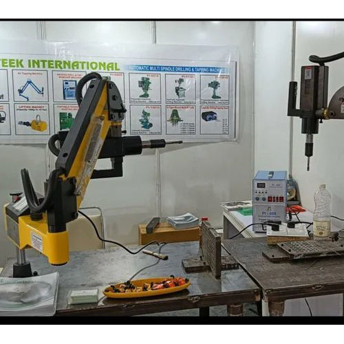 Robotic Arm Tapping Machine