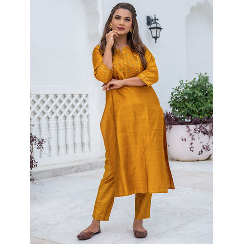 A Straight Silk Mustard Kurta With Pants.