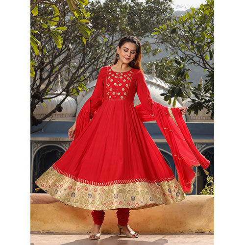 Amaiva Red Anarkali Kurta With Churidar And Dupatta.