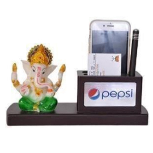 Desktop With Ganesh Ji Murti, Memo Pad And Pen