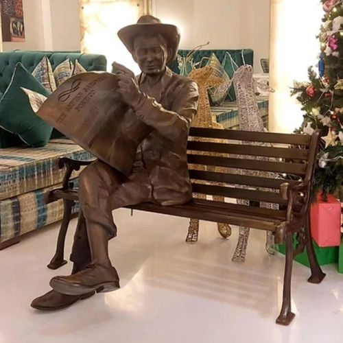 Brown Man Sitting Sculpture