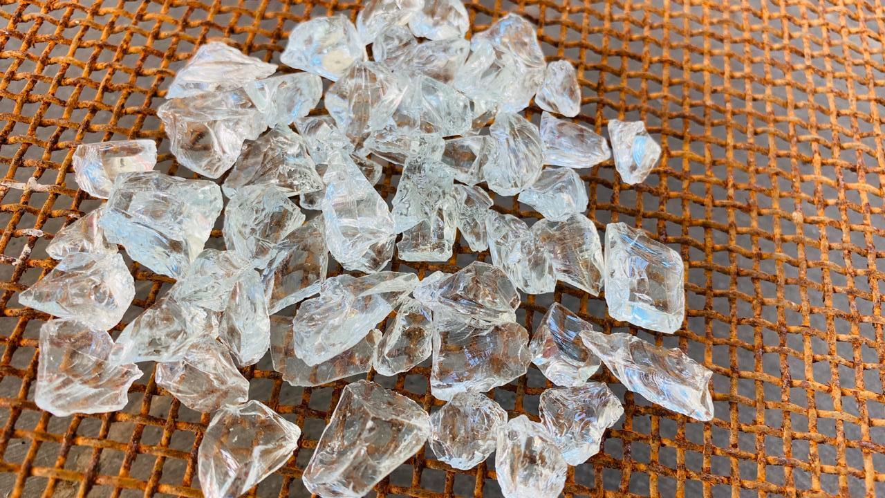 Crushed clear glass chips transparent made of recycled glass for fire pits and garden decorations