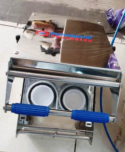 Double cup sealing machine
