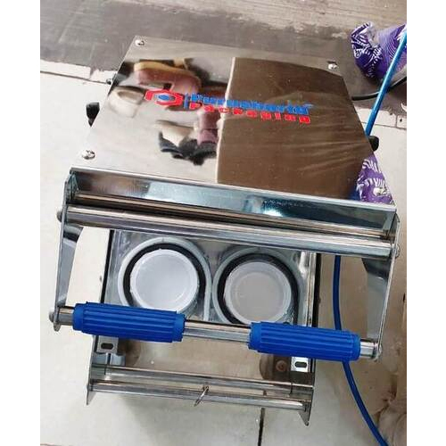 Double cup sealing machine