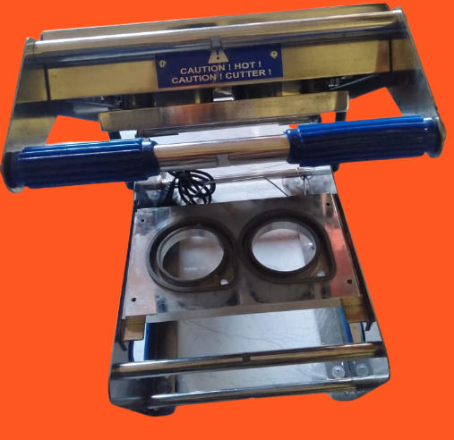 Double cup sealing machine