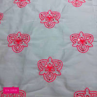 white embroidered cotton fabri