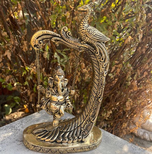 aakrati Swing Ganesh Metal brass table showpiece sculpture for gift and decor Decorative Showpiece - 24 cm  (Brass, Yellow)