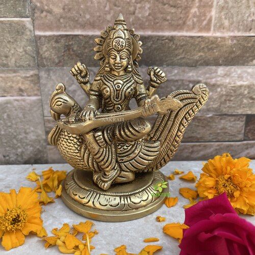 aakrati Saraswati Adorning a Swan. Goddess Beautiful Brass Statue Decorative Showpiece - 10.16 cm  (Brass, Yellow)