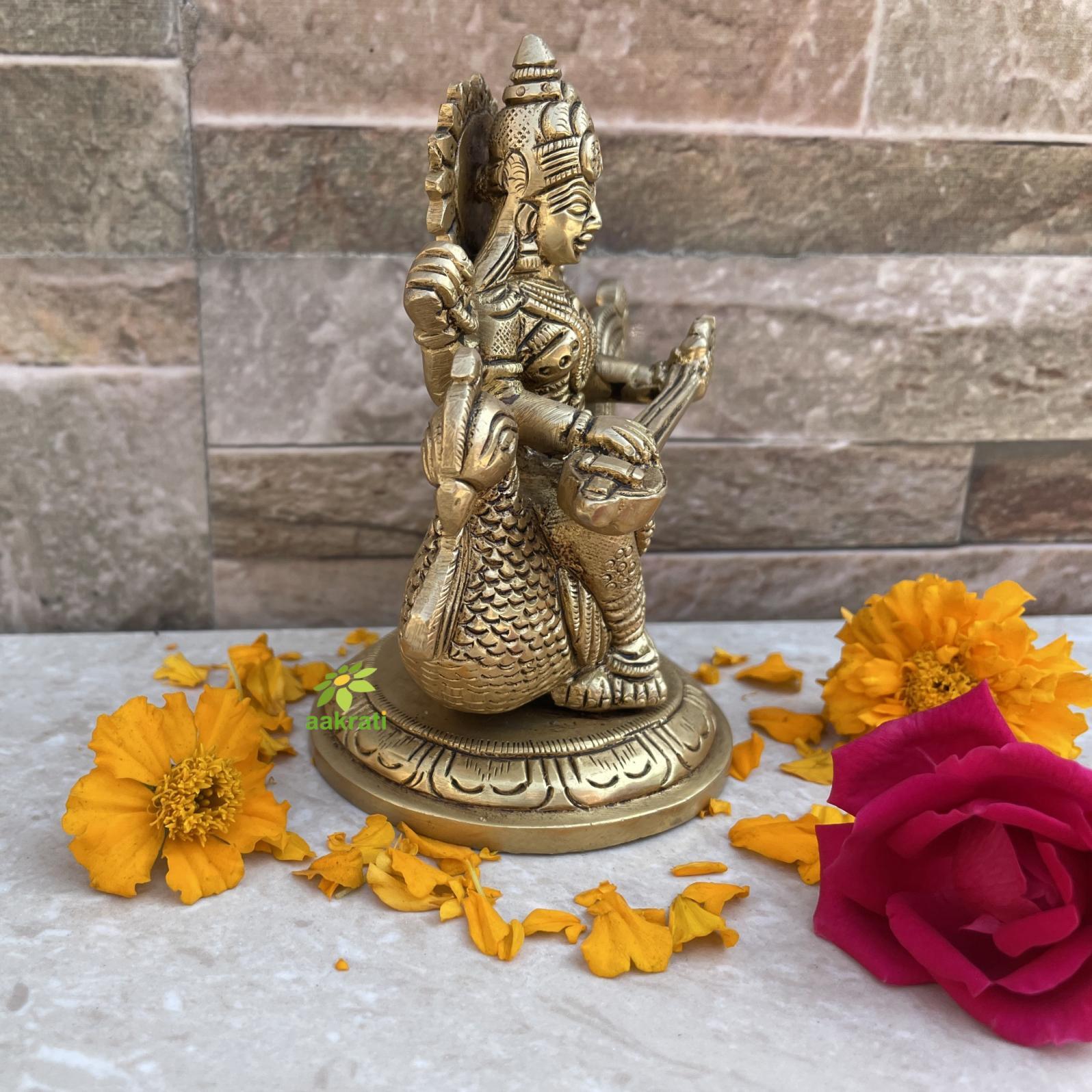 aakrati Saraswati Adorning a Swan. Goddess Beautiful Brass Statue Decorative Showpiece - 10.16 cm  (Brass, Yellow)