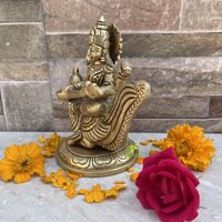 aakrati Saraswati Adorning a Swan. Goddess Beautiful Brass Statue Decorative Showpiece - 10.16 cm  (Brass, Yellow)