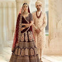 Different Available Maroon Velvet Ladies Lehenga And Mens Wedding Sherwani Set