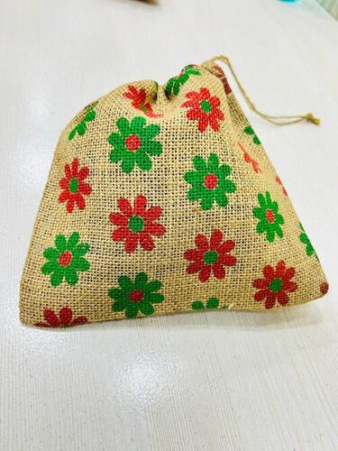 Hand-embroidered jute pouches with drawstrings and flower-printed