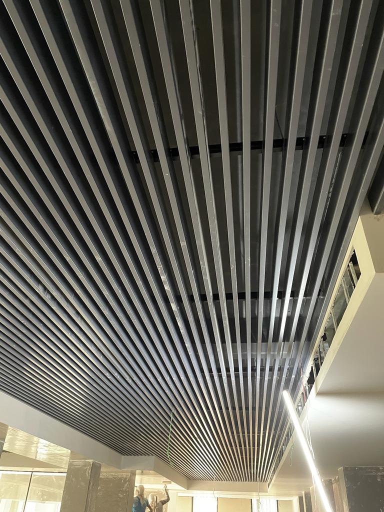 Perforated wooden baffle ceiling