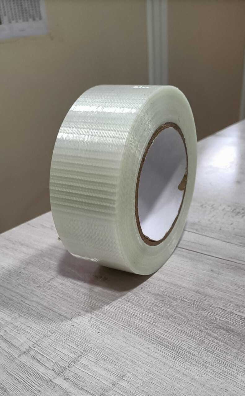 Cross Filament Tape - Polyester Film And Glass Yarn, 50mm Width X 140-150 Micron Thickness, Cross Transparent Color | Heavy Duty Packaging, Hot Melt Adhesive, Moisture Resistant, Strong Adhesive, 40% Elongation, 6 Months Shelf Life