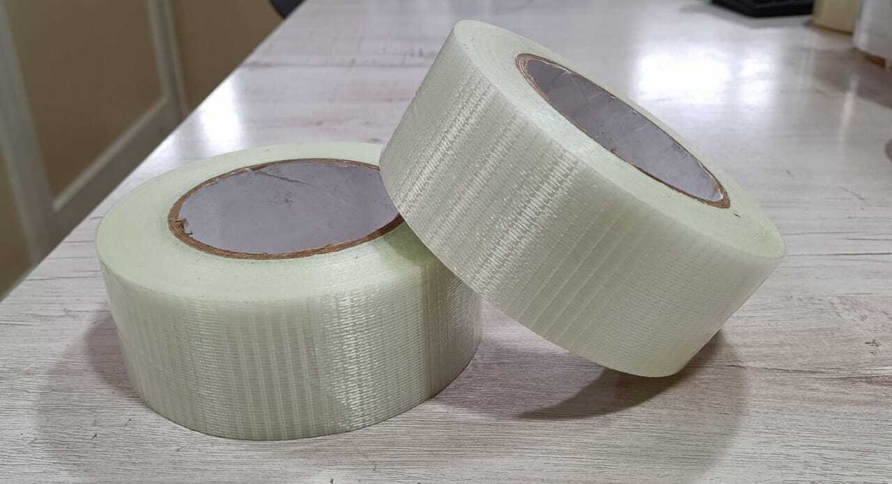 Cross Filament Tape - Polyester Film And Glass Yarn, 50mm Width X 140-150 Micron Thickness, Cross Transparent Color | Heavy Duty Packaging, Hot Melt Adhesive, Moisture Resistant, Strong Adhesive, 40% Elongation, 6 Months Shelf Life