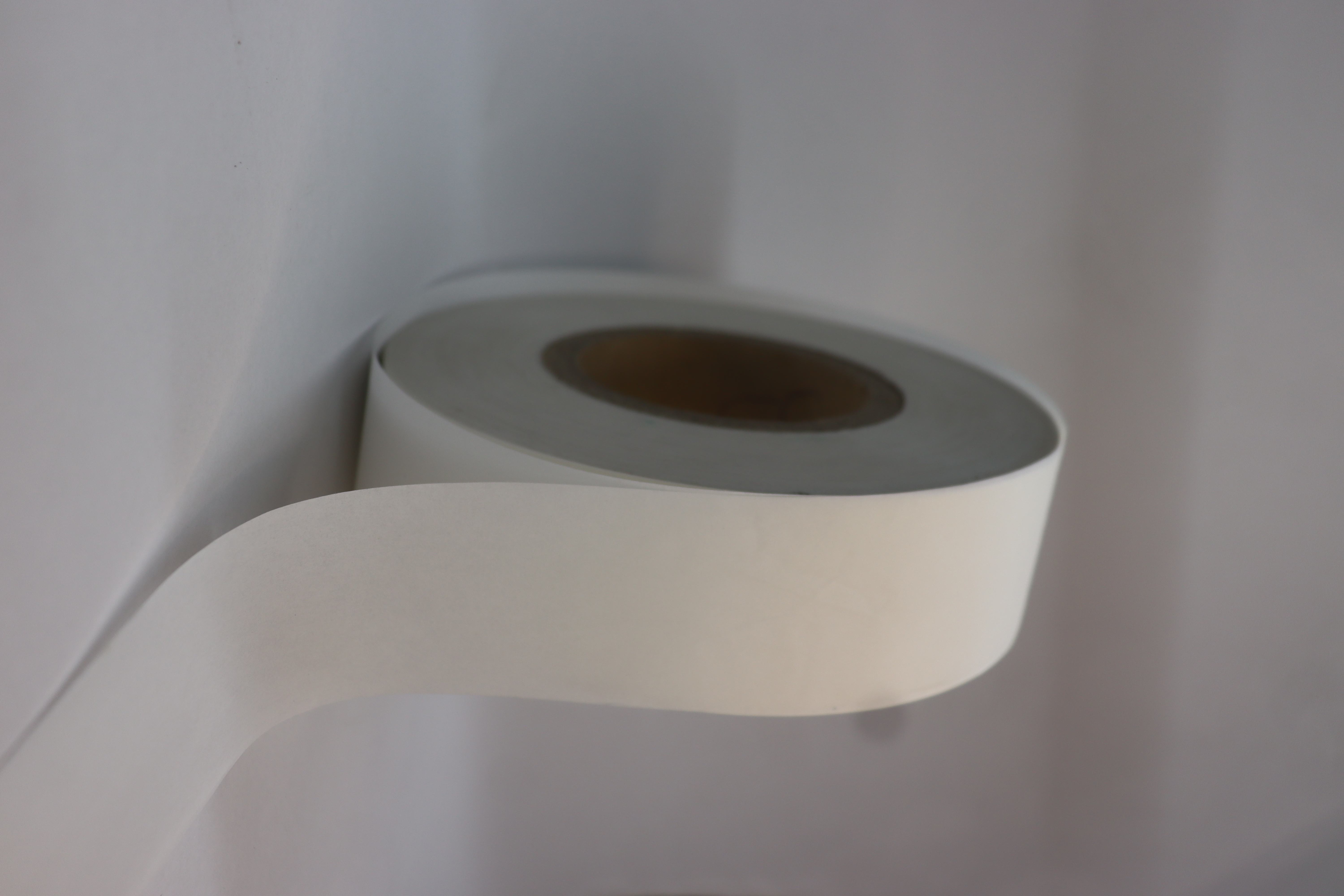 Sanitary Napkin Back Release Paper Roll - Silicone Coated, Lightweight Smooth Paper, Continuous Roll Format, Custom Sizes Available