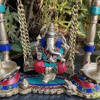 Turquoise work Brass Ganesha Swing with Oil Lamp with Peacock Design with stone work