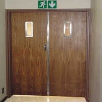Wooden Fire Door - 45mm Thick, Powder-coated Protection | Elegant Brown Finish, Vertical Opening Design For Industrial Applications
