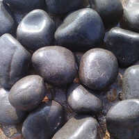 Wet Black River Pebbles