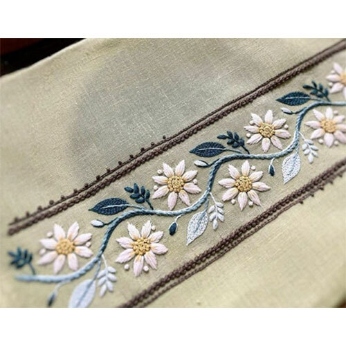 Woven fabric with hand embroidery