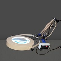 Illuminated magnifier with clamp