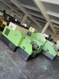 Nut Former - Cold-forming Metal Machine | Automated Feeding, Forming Dies, Thread Rolling Mechanism, Punching System, Cutting Mechanism