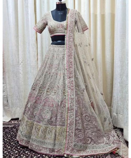 Off-white georgette lehenga choli with hand cut dana and sequins work
