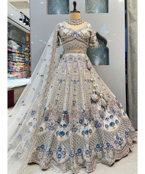 Off-white georgette lehenga choli with hand cut dana and sequins work