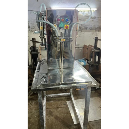 Ss Double Nozzel Bottle Filing Machine - Capacity: 100 To 1000 Ml Milliliter (Ml)