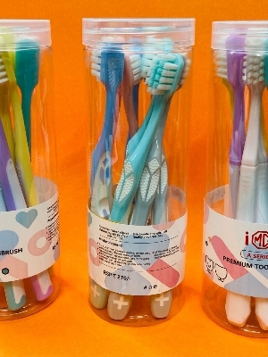Multi-Colored Manual Adult Toothbrushes Packaged in Clear Plastic Jar