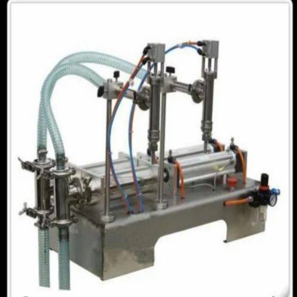 SEMI AUTOMATIC DOUBLE HEAD LIQUID FILLING MACHINE 