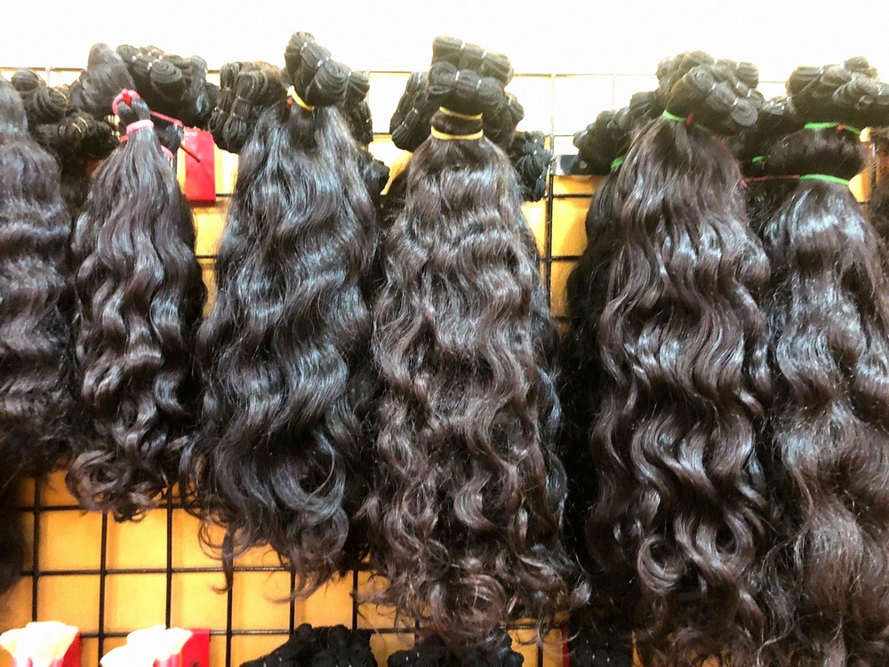 NATURAL SOFT CURLY HAIR EXTENSIONS IN FACTORY PRICE