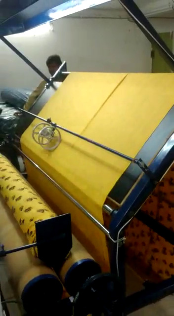 Fabric Inspection with Rolling Machine in Wooden Board