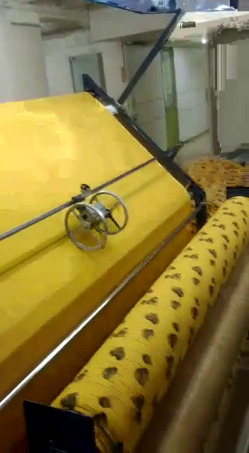 Fabric Inspection with Rolling Machine in Wooden Board