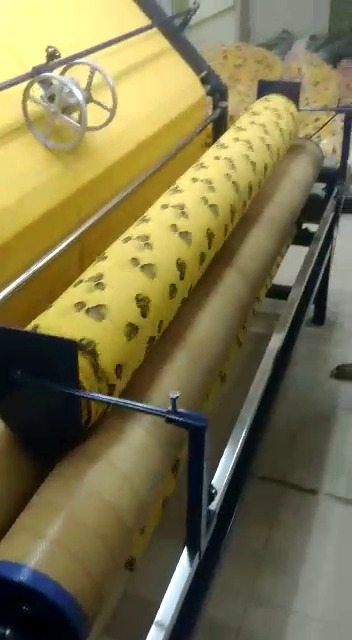Fabric Inspection with Rolling Machine in Wooden Board