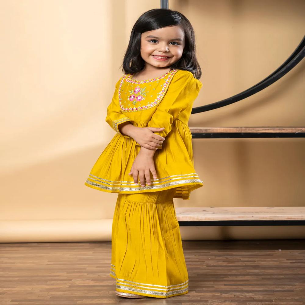 Peplum Style Roman Silk Fabric Yellow Color Kurti With Sharara 