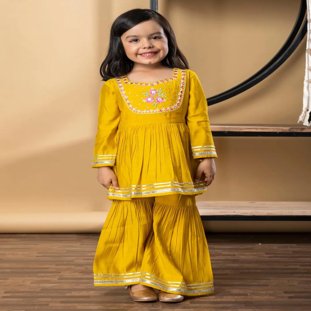 Peplum Style Roman Silk Fabric Yellow Color Kurti With Sharara 