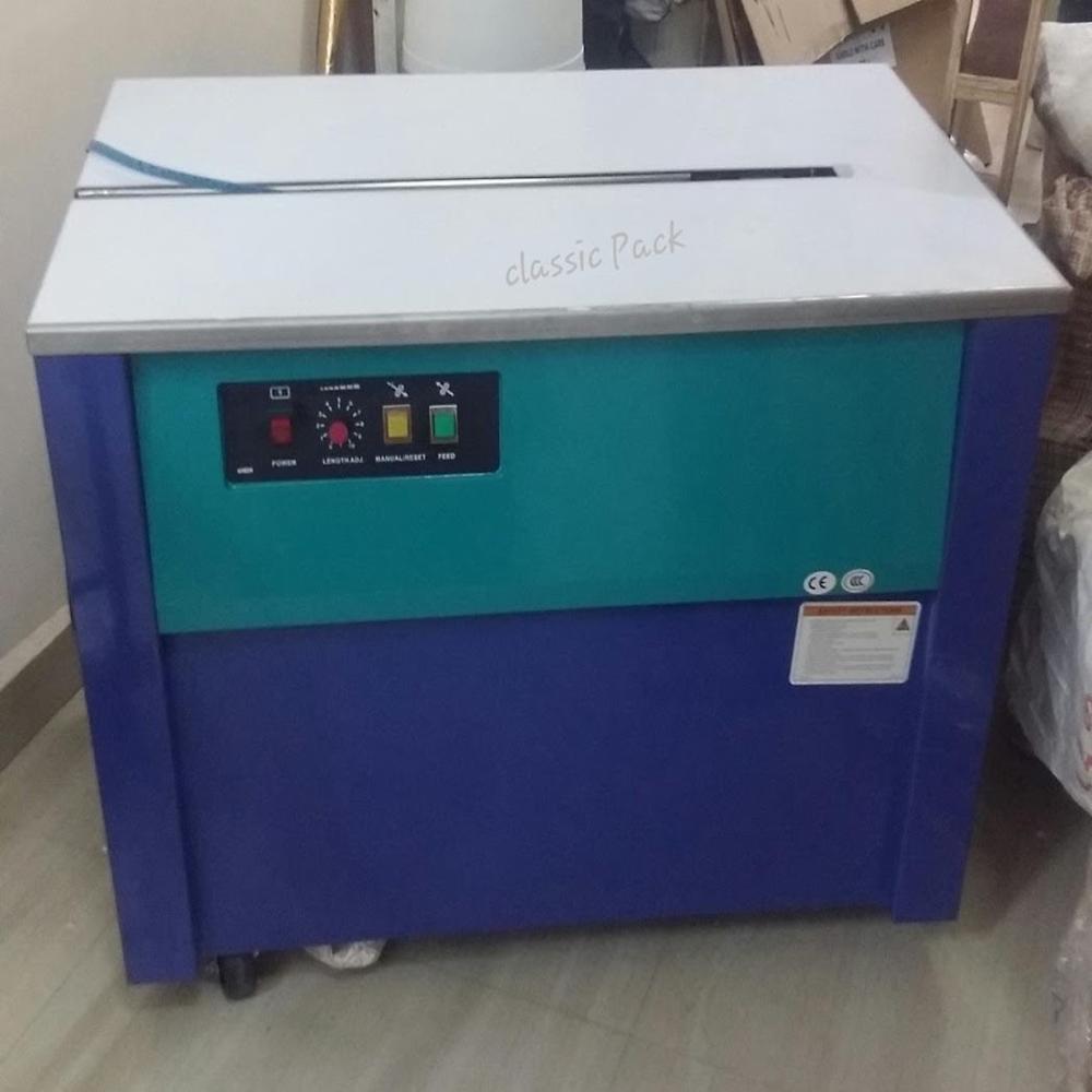 SEMI AUTOMATIC STRAPPING MACHINE
