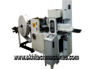 Two size paper napkin machine