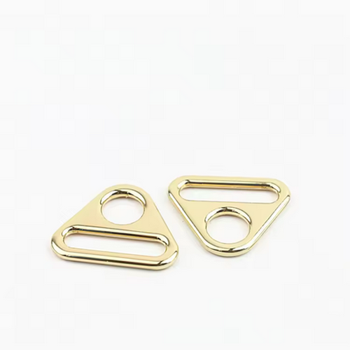 Hardware accessories for luggage and handbags, including zinc alloy round hole adjustment buckles, triangular webbing buckles, and chain link plates suitable for women's handbag components.