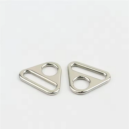 Hardware accessories for luggage and handbags, including zinc alloy round hole adjustment buckles, triangular webbing buckles, and chain link plates suitable for women's handbag components.
