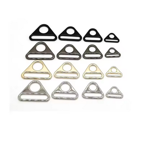 Hardware accessories for luggage and handbags, including zinc alloy round hole adjustment buckles, triangular webbing buckles, and chain link plates suitable for women's handbag components.