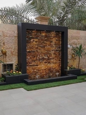 Wall side stone fountain